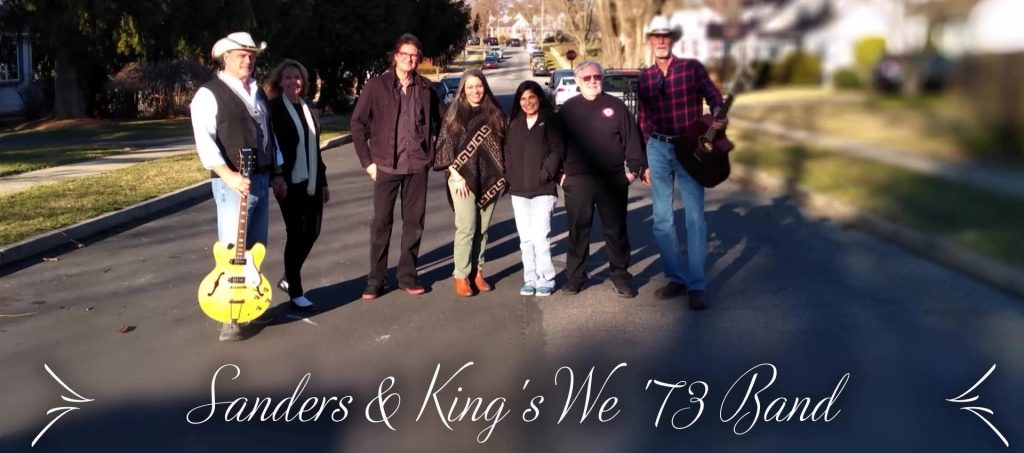 Sanders and King's We '73 Band posing on street